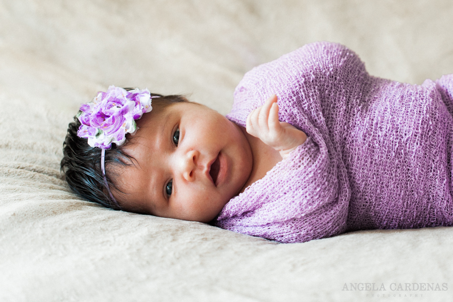 newborn baby girl with purple colors 